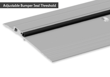 Door threshold bumper seal in black vinyl. Commercial door threshold is ADA comp