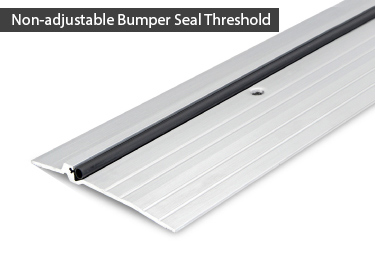 Door threshold bumper seal in black vinyl. Commercial door threshold is ADA comp