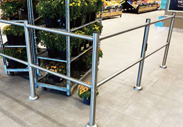 Modular rail system in brushed stainless steel guides customers in the store